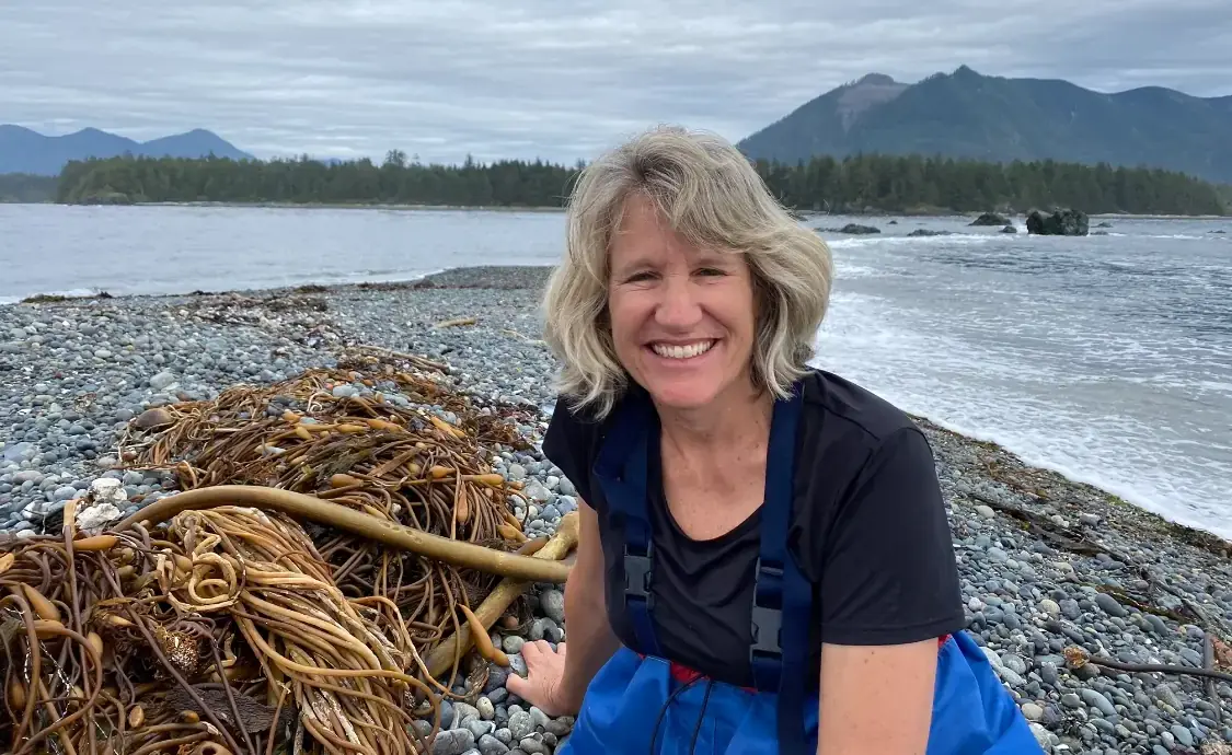Ellen sitting at the beach